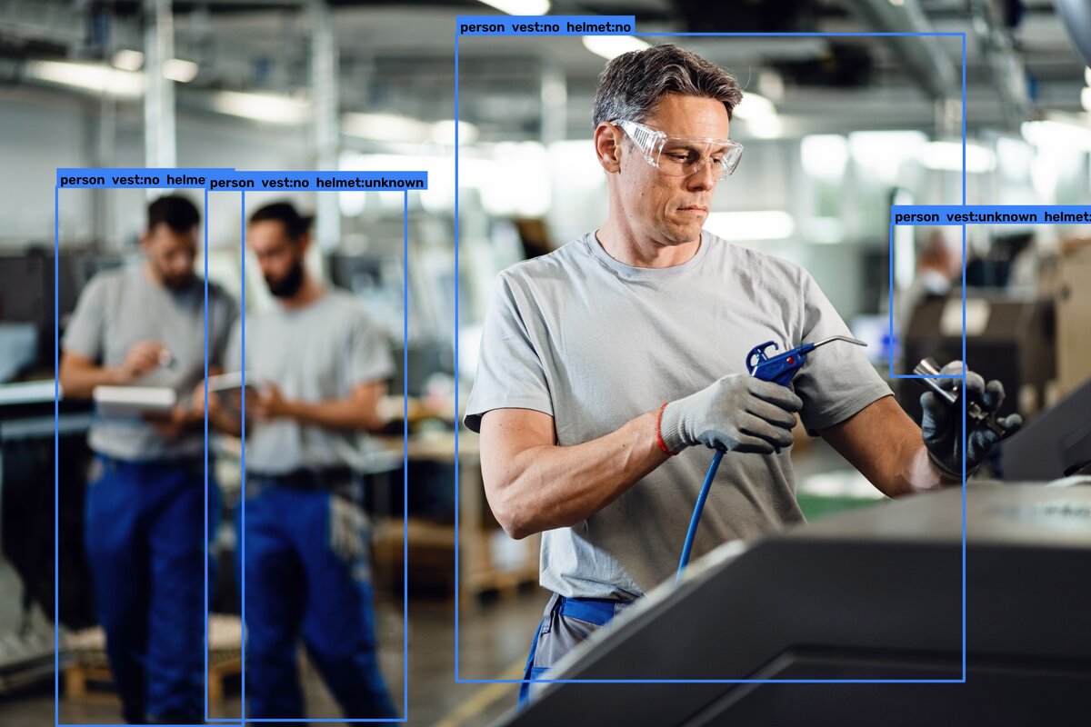 A real camera frame where thevisionqc flags a worker without a helmet on the floor